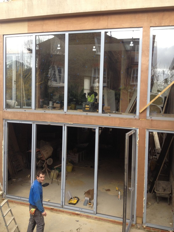 Aluminium bi-fold doors with two-storey glazing in Wallington